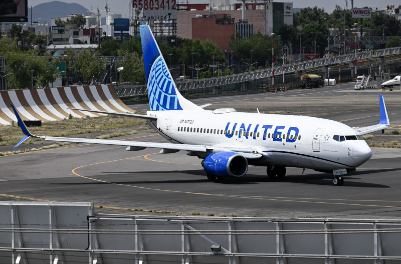 Photo of N13720 - United Airlines Boeing 737-700 at MEX on AeroXplorer Aviation Database