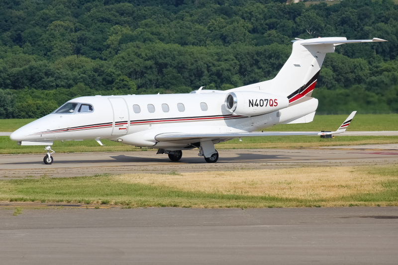 Photo of N407QS - NetJets Embraer Phenom 300 at LUK on AeroXplorer Aviation Database