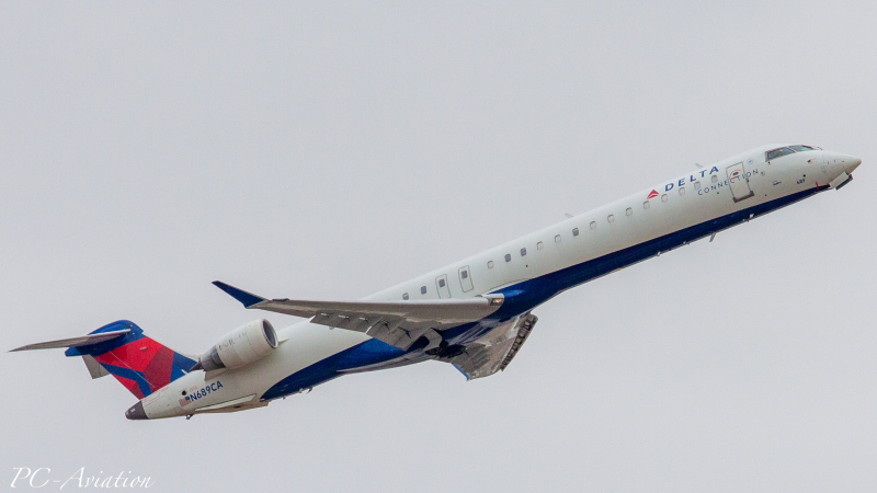Photo of N689CA - Delta Connection Mitsubishi CRJ-900 at IAH on AeroXplorer Aviation Database