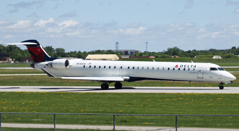 Photo of N548CA - Delta Connection Mitsubishi CRJ-900 at FAR on AeroXplorer Aviation Database