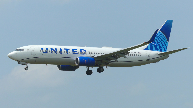 Photo of N14235 - United Airlines Boeing 737-800 at BZE on AeroXplorer Aviation Database