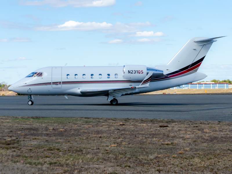 Photo of N231QS - NetJets Bombardier Challenger 650 at BLM on AeroXplorer Aviation Database