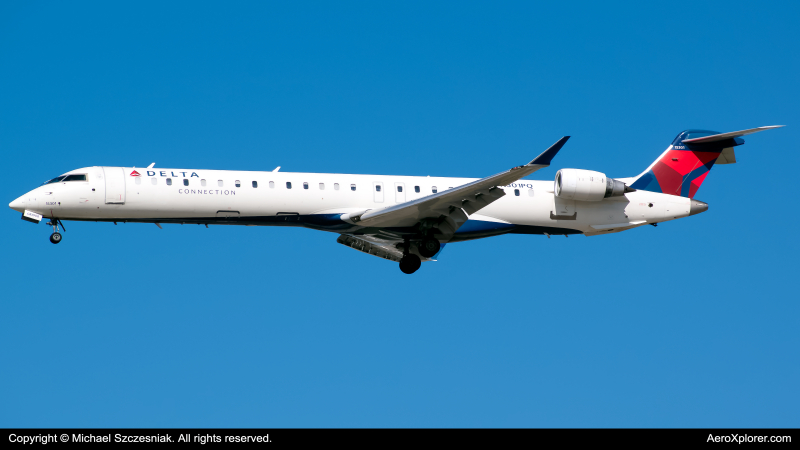 Photo of N301PQ - Delta Connection Mitsubishi CRJ-900 at ORD on AeroXplorer Aviation Database