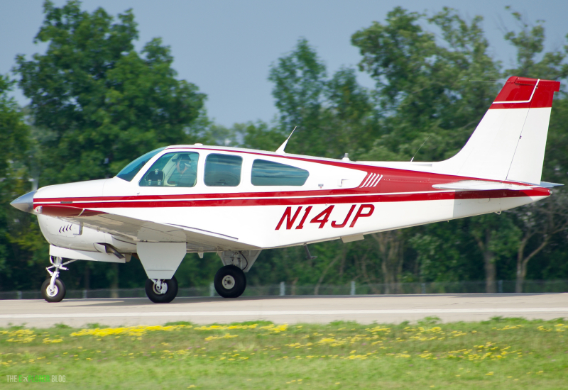 Photo of N14JP - PRIVATE Beech F33-C Bonanza at OSH on AeroXplorer Aviation Database