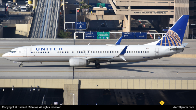 Photo of N69830 - United Airlines Boeing 737-900ER at PHX on AeroXplorer Aviation Database