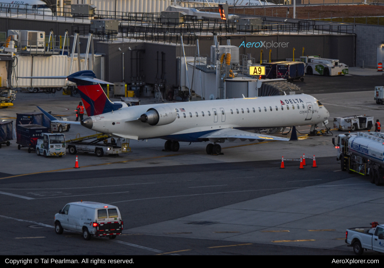 Photo of N308PQ - Delta Connection Mitsubishi CRJ-900 at JFK on AeroXplorer Aviation Database