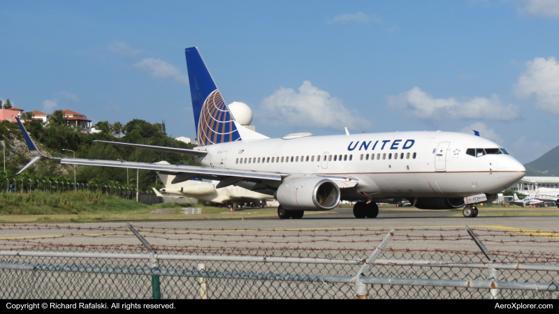Photo of N27724 - United Airlines Boeing 737-700 at SXM on AeroXplorer Aviation Database
