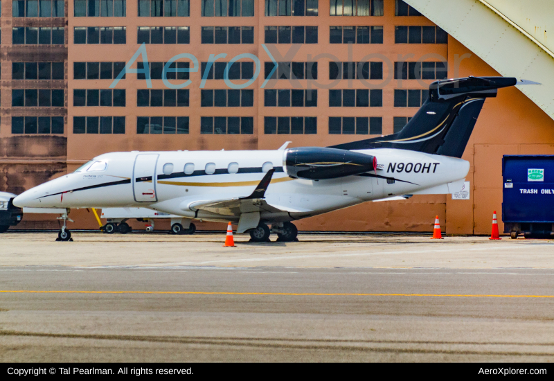 Photo of N900HT - PRIVATE Embraer Phenom 300 at DCA on AeroXplorer Aviation Database