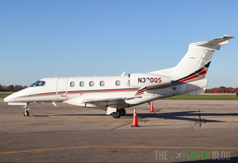 Photo of N330QS - NetJets Embraer Phenom 300 at OSU on AeroXplorer Aviation Database