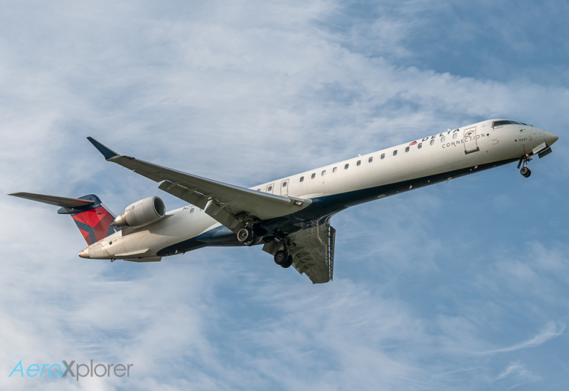 Photo of N297PQ - Delta Connection Mitsubishi CRJ-900 at JFK on AeroXplorer Aviation Database