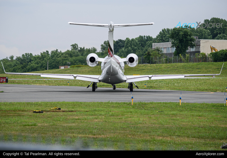 Photo of N374QS - NetJets Embraer Phenom 300 at GAI on AeroXplorer Aviation Database