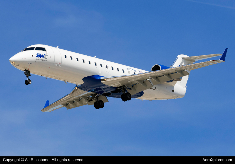 Photo of N877AS  - SkyWest Charter  Mitsubishi CRJ-200 at MKE on AeroXplorer Aviation Database
