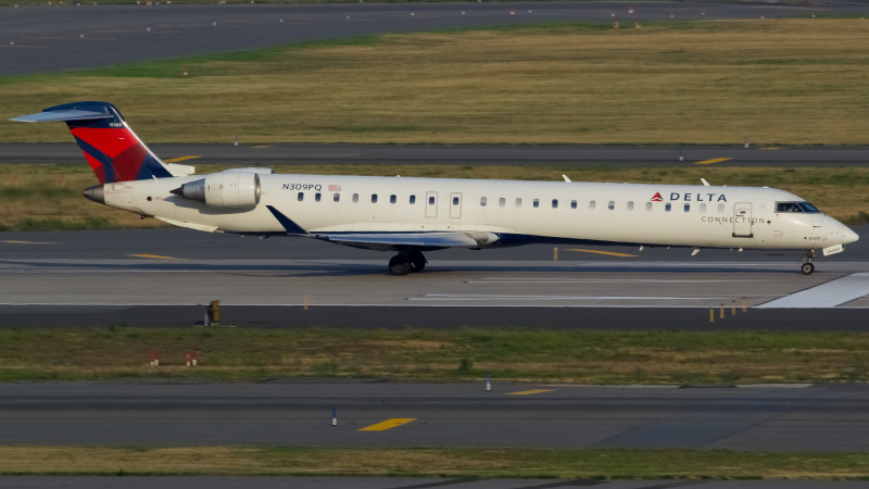 Photo of N309PQ - Delta Connection Mitsubishi CRJ-900 at JFK on AeroXplorer Aviation Database