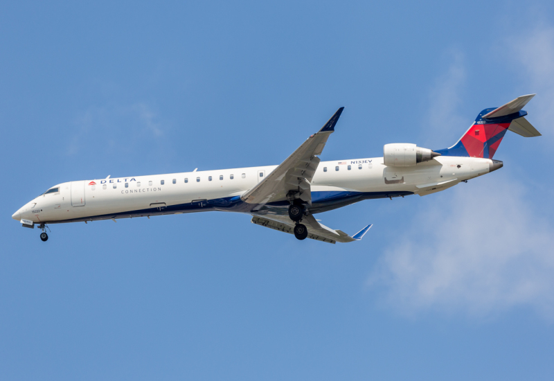 Photo of N133EV - Delta Connection Mitsubishi CRJ-900 at JFK on AeroXplorer Aviation Database