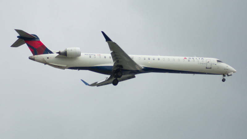 Photo of N330PQ - Delta Connection Mitsubishi CRJ-900 at ORD on AeroXplorer Aviation Database