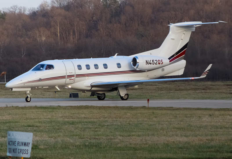 Photo of N452QS - NetJets Embraer Phenom 300 at LUK on AeroXplorer Aviation Database