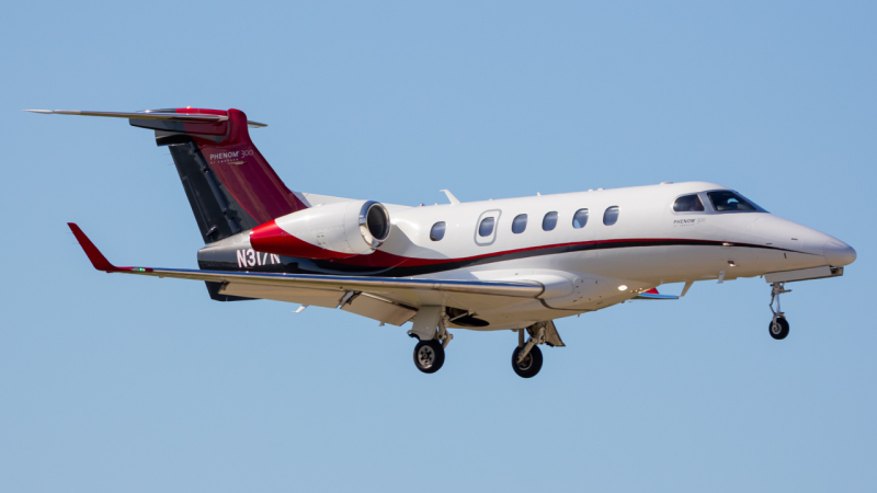 Photo of N317N - PRIVATE Embraer Phenom 300 at APF on AeroXplorer Aviation Database