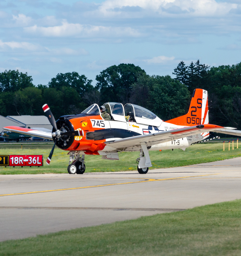 Photo of N745W - PRIVATE North American T-28 at OSH on AeroXplorer Aviation Database